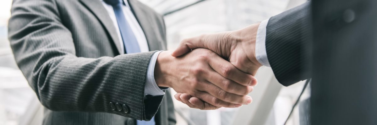 businessman-making-handshake-with-partner